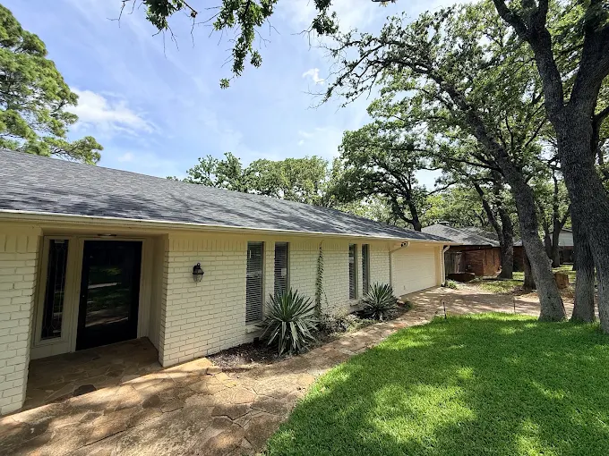Freshly replaced shingle roof on a single-story home