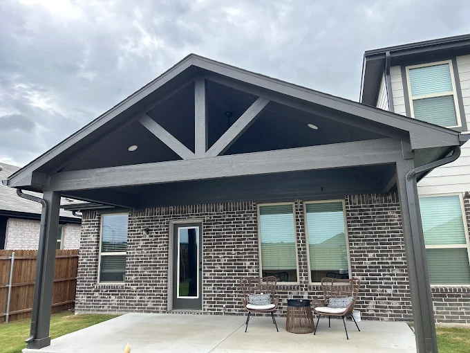 Gray gable roof over a covered patio addition